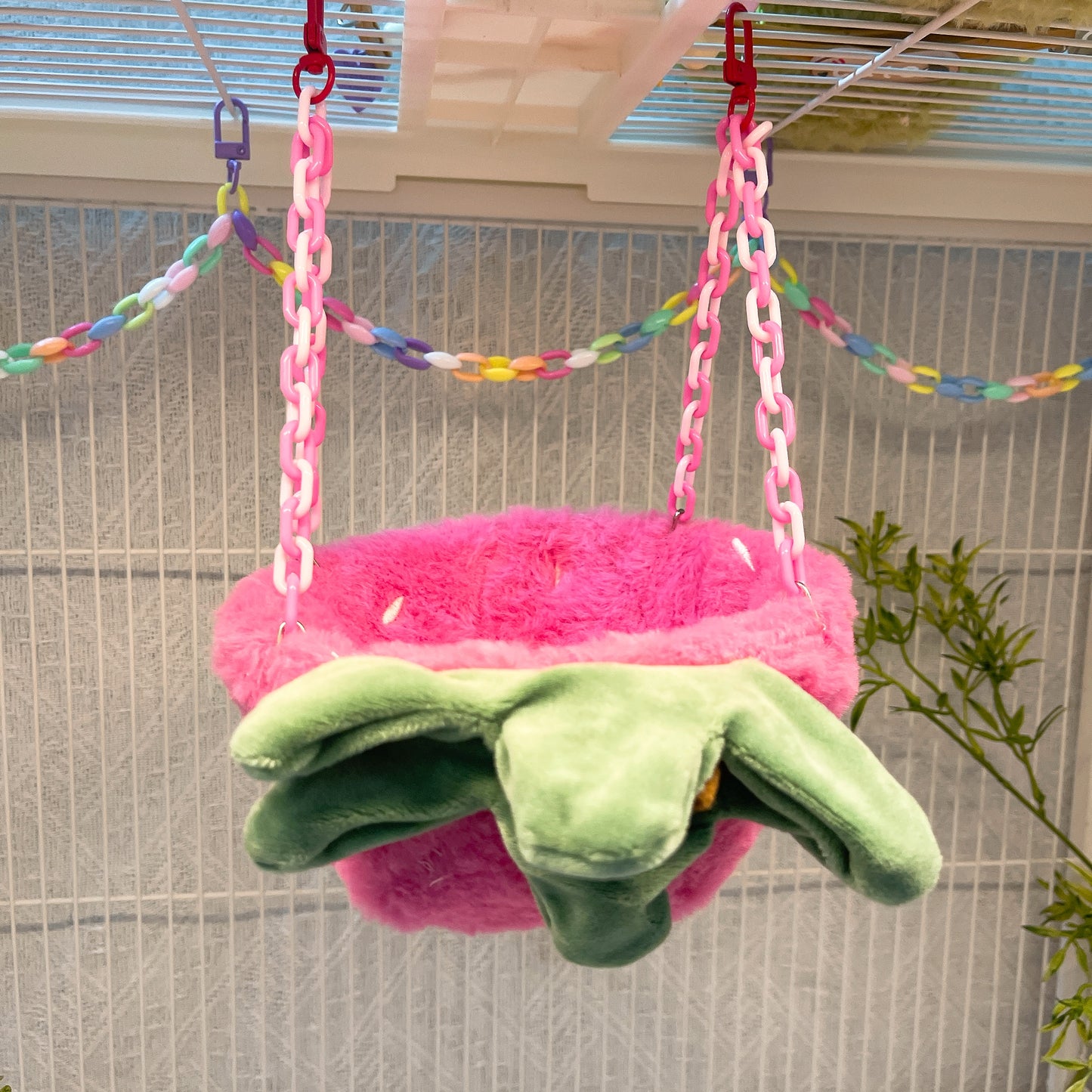 Happy Strawberry Design Parrot Bird Nest, equipped with hooks and plastic chains, suitable for cage use. The cotton-filled half-moon shape provides a comfortable sleeping spot for pet birds.